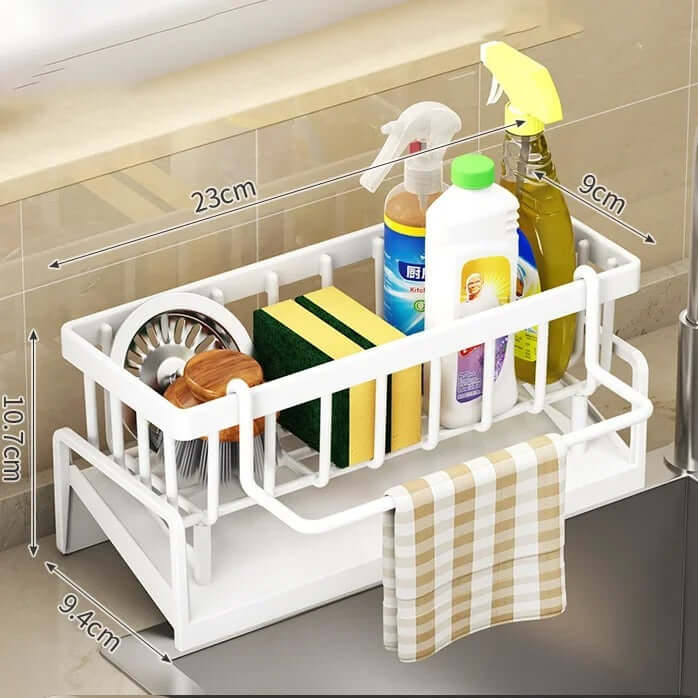 Adjustable sink storage and drainage rack with sponges, cleaning supplies, and a dishcloth for kitchen organization.