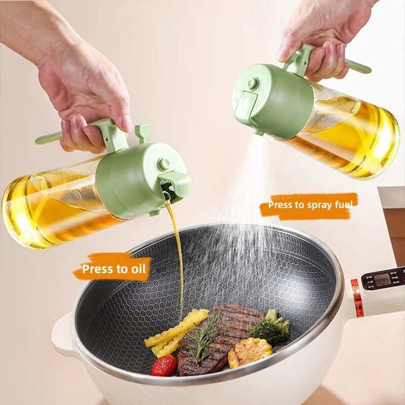 Dual-function glass oil dispenser and sprayer in use over a frying pan with vegetables and steak.