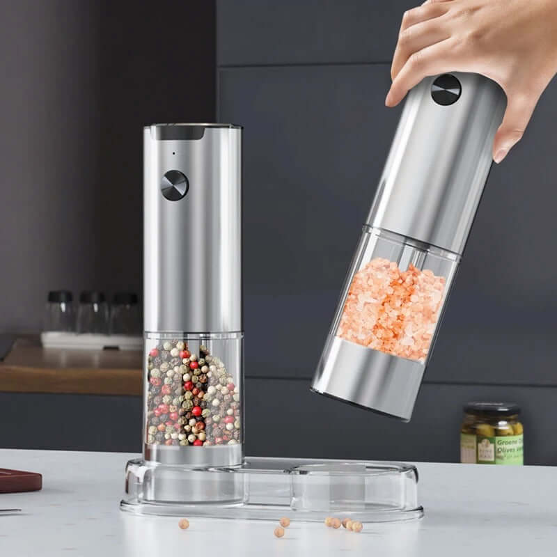 Electric salt and pepper grinder set with adjustable settings, sleek silver design, perfect for modern kitchens.