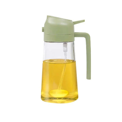 2-in-1 glass oil dispenser and sprayer with green lid, ergonomic handle, and visible oil level for precise pouring.